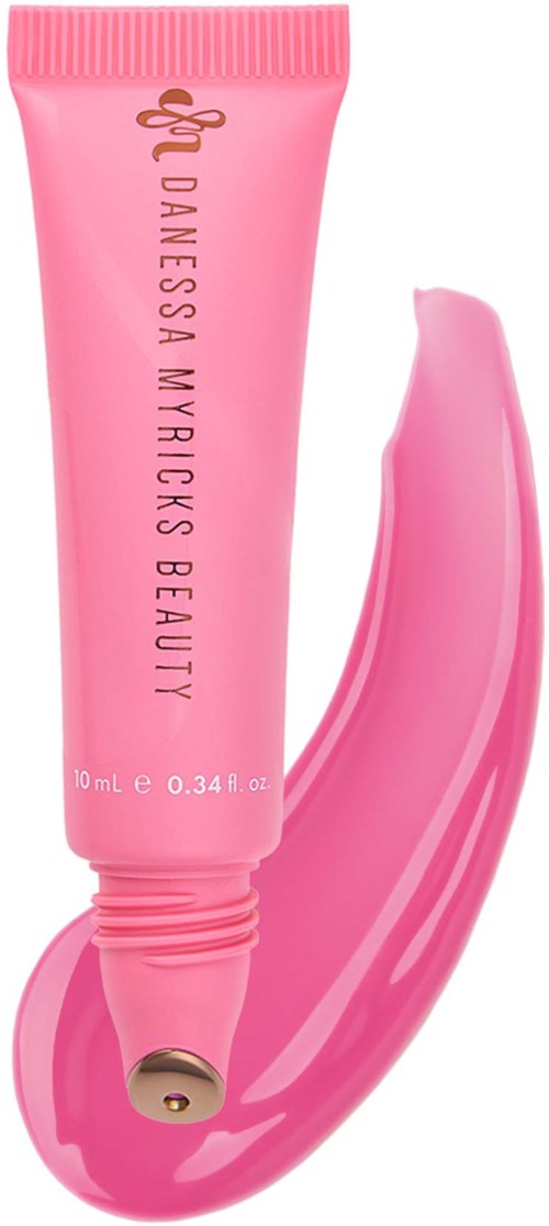Pink tube of D Anessa Myricks Beauty product with a smear of product next to it.