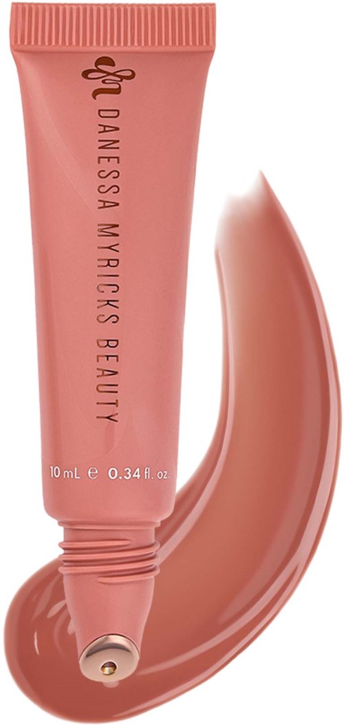 Pink tube of Danneska Myrick's Beauty lip gloss with a swatch of gloss next to it.