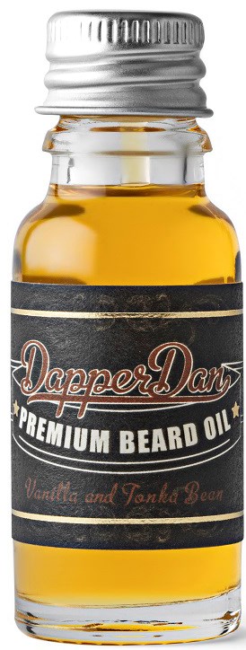 En liten glasflaska med skäggolja med svart etikett och silverlock, märkt Dapper Dan, doft av vanilj och tonkaböna.