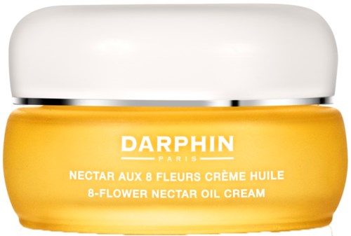 En gul beholder med Darphin nektar oljekrem med hvit lokk, merket på fransk og engelsk.