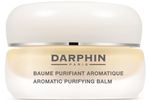 Een potje Darphin aromatische zuiverende balsem in beige en wit met een metalen deksel.