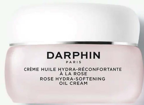 Ein Glas Darphin Rosenölcreme, rosa Behälter mit weißem Deckel, Text auf Englisch und Französisch.