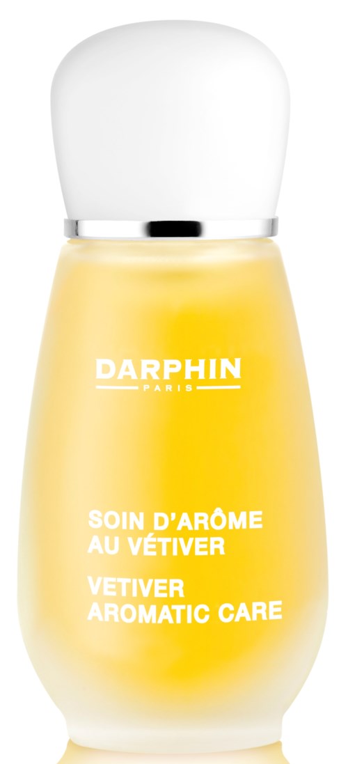 En gul flaske med hvit lokk og teksten 'Darphin Paris' og 'Vetitver Aromatic Care'.