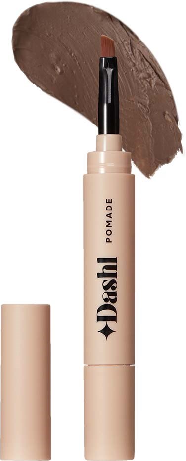 A beige lip balm stick with the brand name Dashh Pomade, showing a swatch of brownish lip color.