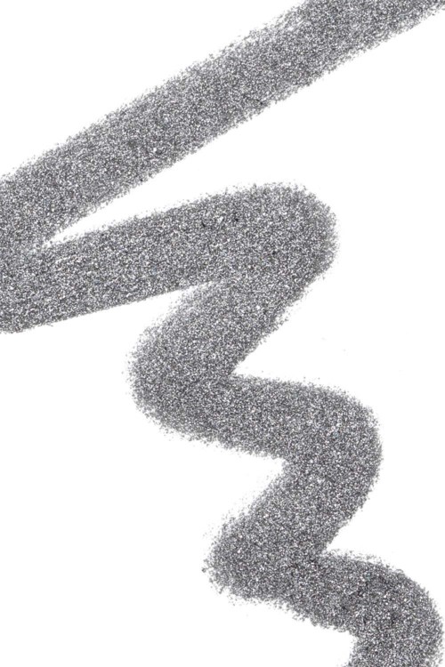 A silver glittery line and a wavy squiggle on a white background.