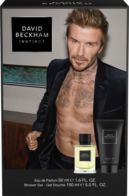 David Beckham Instinct-logga med en man utan skjorta som visar parfym och duschgeler.