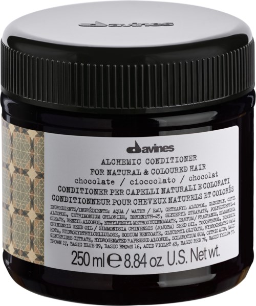 En svart burk av Davines Alchemic Conditioner för färgat hår, med vit etikett, lock och produktdetaljer.