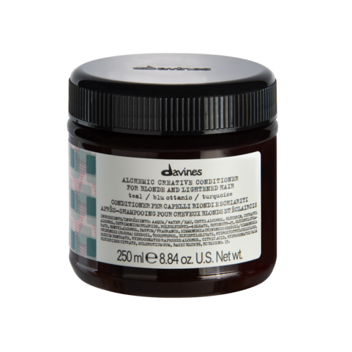 En mørk brun krukke med Davines alkemisk balsam for blondt og lysnet hår, 250 ml.
