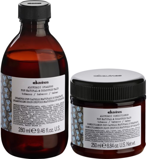 To hårpleieflasker, ett sjampo og en balsam, med svarte lokk og etiketter som viser produktdetaljer.