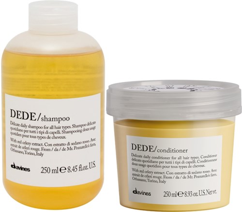 Two yellow bottles, one shampoo and one conditioner, both labeled with brand and size details.