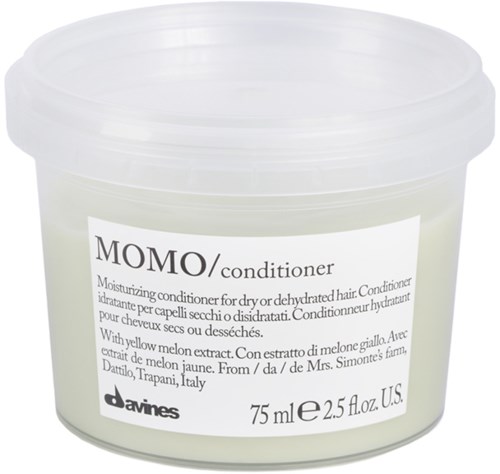 En hvid beholder med mærkat for MOMO balsam, indeholder 75 ml, lavet af Davines, til tørt hår med melon ekstrakt.