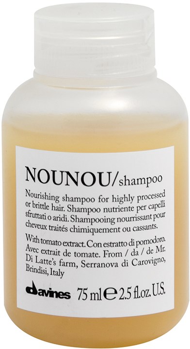 En lille, hvid plastikflaske med Nounou-shampoo med hvid label og sort tekst.