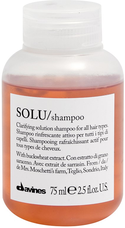 A bottle of Solu shampoo with white cap and a white label showing product details.