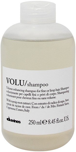 En vit schampoflaska med etikett som visar märket 'VOLU' och volymen 250 ml.