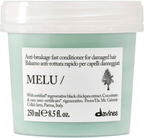 En ljusgrön burk med Melu anti-trasigt hårbalsam med vit lock och etikett som visar produktinformation.
