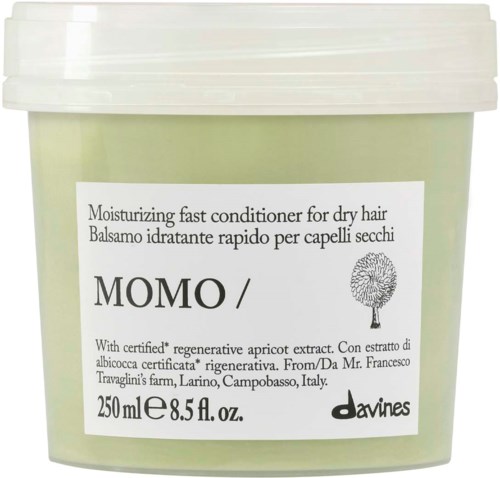 Grönt lock av snabbverkande fuktgivande balsam för torrt hår med aprikosextrakt och Davines logotyp.