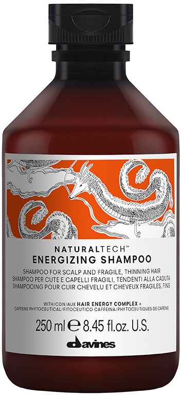 En brun flaske med Davines Energizing Shampoo med en drage illustration på etiketten.