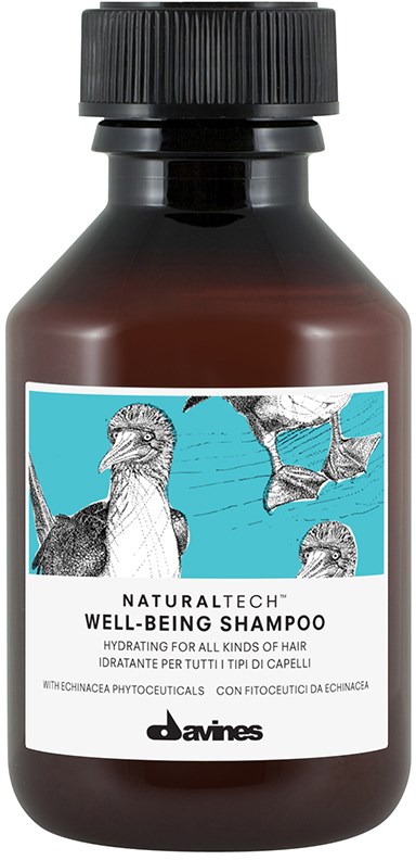 En brun flaske med Davines Well-Being Shampoo med fugleillustrationer på etiketten.