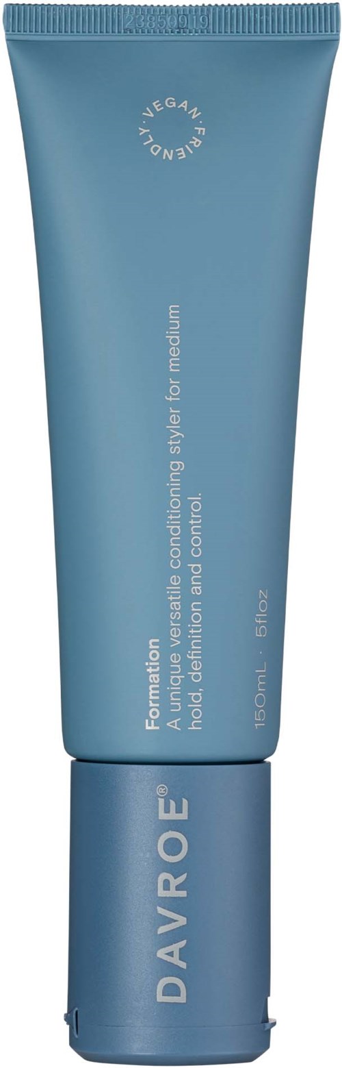 A blue tube labeled DAVROE with a vegan claim and product description for hair treatment and control.