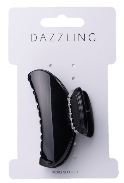 En svart hårklämma håller håret, fäst vid vit förpackning märkt 'DAZZLING' och 'NICKEL SECURED' med hål för upphängning.