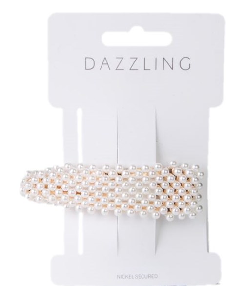 Hårklämma med pärlor på vit bakgrund med "DAZZLING" i versaler.