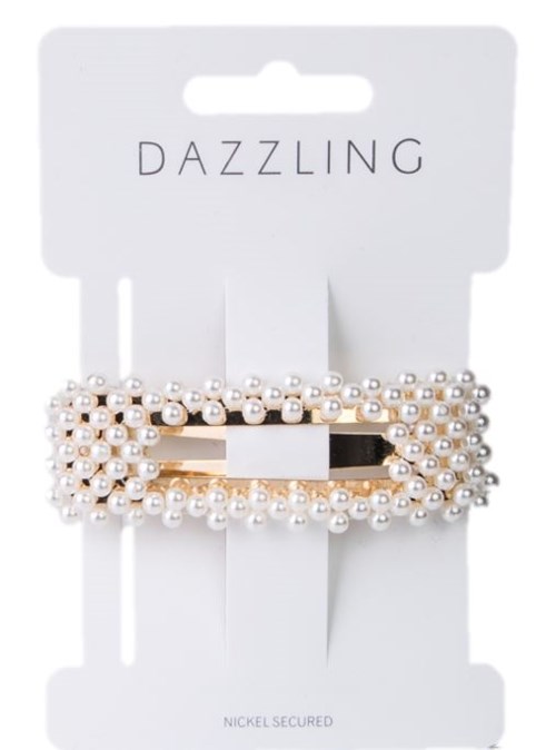 Et korallfarget hårklype dekorert med hvite perler på hvit bakgrunn, med merkenavnet "DAZZLING" over.