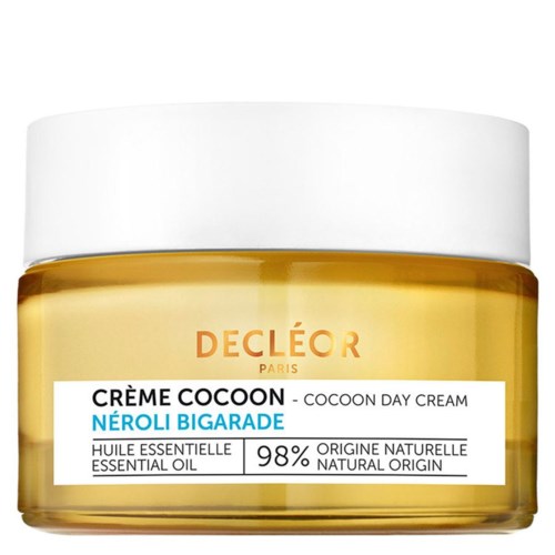 A jar of Decléor cocoon day cream with essential oils and natural ingredients, mostly yellow and white colors.