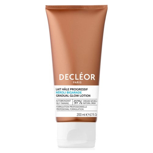 A brown tube of Decleor glow lotion with white label, some text in French, about self-tanning and natural formula.