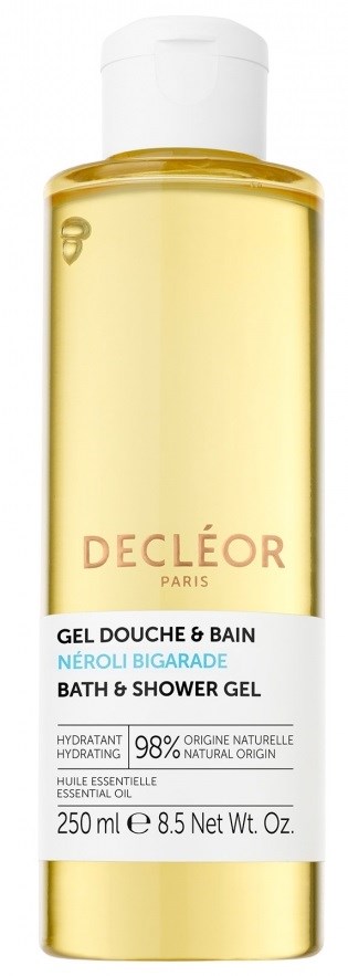 En lång, klar gul flaska med vit kork, innehållande bad- och duschgel från Decléor Paris.