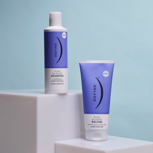 Two hair care products, a shampoo and a conditioner, in blue bottles with brand and product names.