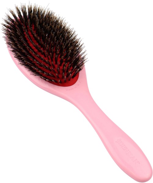 A pink hairbrush with black and red bristles arranged in a rounded shape.