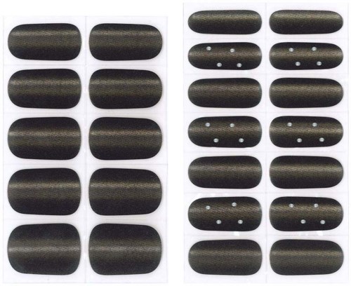 Two sets of black nails, some with white dots, arranged in rows in a plastic tray.