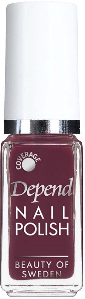 En flaska nagellack från Depend i mörkröd färg med vit pump.
