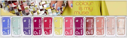 A row of colored nail polish bottles in blue, pink, and yellow, with a woman painting her nails. Text says, "colour is my muse."