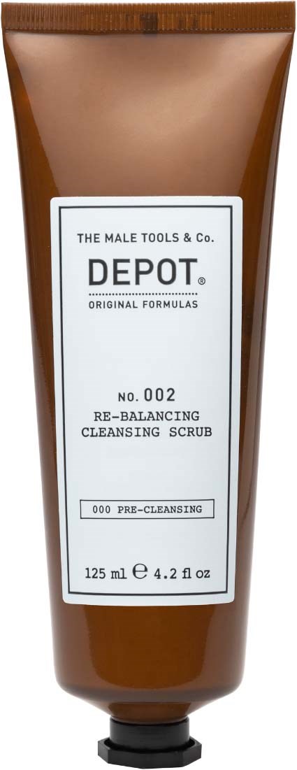 En brun tub märkt 'Depot' innehåller en ansiktsskrubb. Den kommer från The Male Tools & Co. och är för förrengöring.