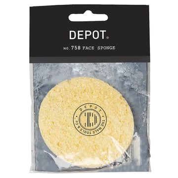 En rund gul ansiktssvamp med svart och vitt DEPOT-märke på förpackningen.
