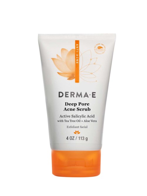 A white and orange facial scrub tube with text about acne treatment and natural ingredients.