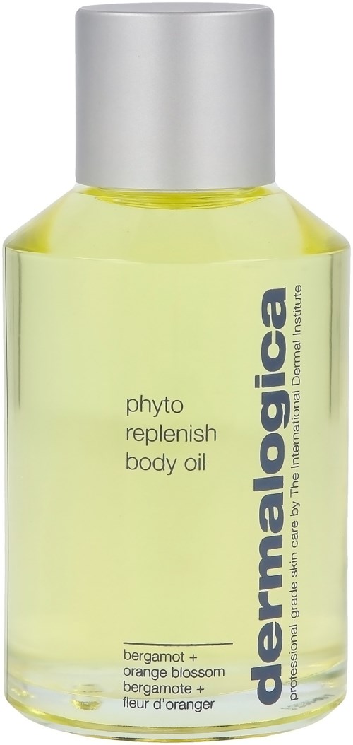 En klar gul flaska märkt 'dermalogica' med kroppsolja inuti, kallad 'phyto replenish body oil' med bergamot och apelsin.