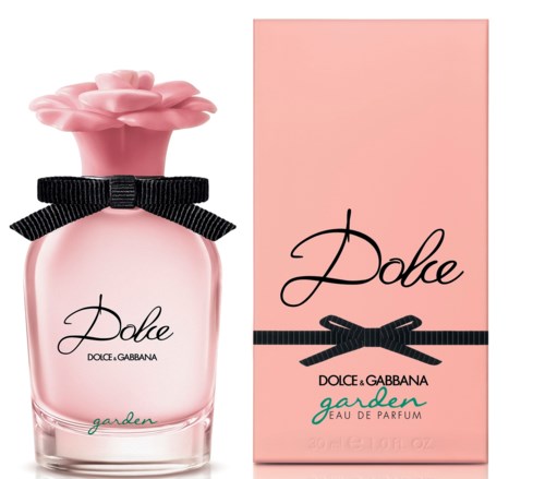 En rosa parfyllåda med en blomformad topp, en svart rosett och en matchande box. Texten säger "Dole" och "garden."