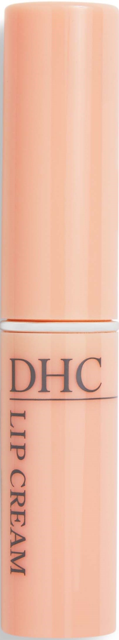 Een perzikkleurige tube met de tekst 'DHC Lip Cream'. Het lijkt een cosmetisch product voor lippen.