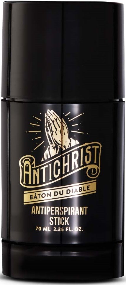 En svart antiperspirantstift med gull- og hvit etikett, bønnehendene og religiøse ord.