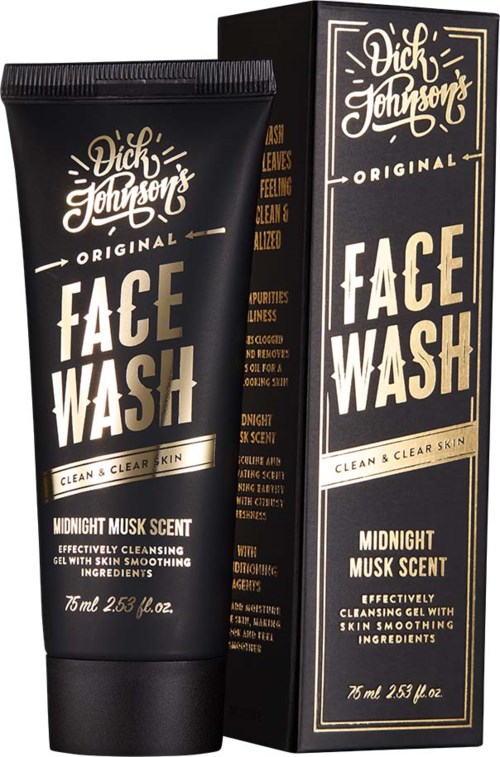 En svart tub med tillhörande förpackning, båda märkta 'Dick Johnson Face Wash,' med vit och guld text, som indikerar en hudvårdsprodukt.