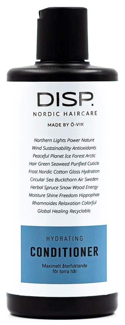 En svart og hvit balsamflaske med blå etikett, inneholder Nordic Haircare-formel for tørt hår.