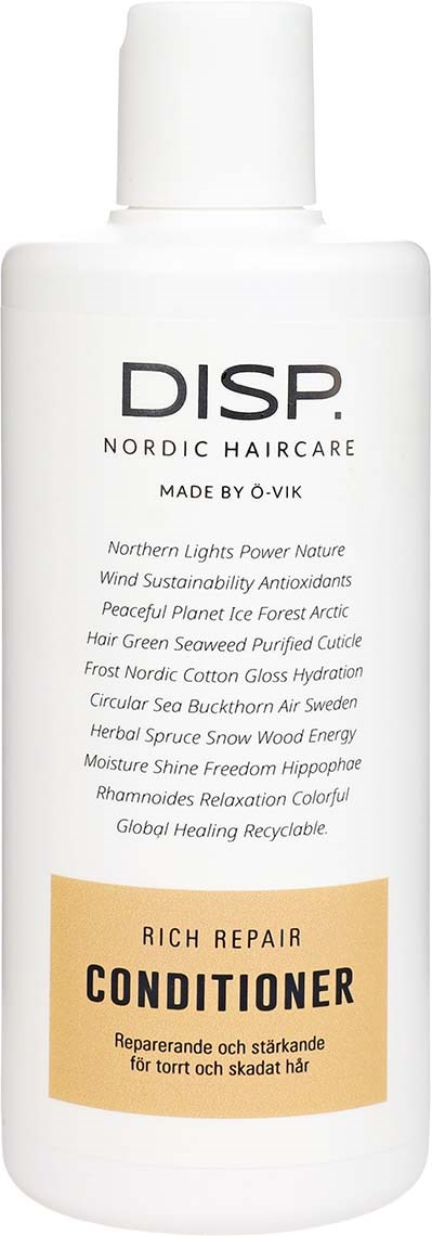 En hvit flaske merket DIS.P Nordic Haircare Rich Repair Conditioner, med beskrivelse av ingredienser og fordeler.