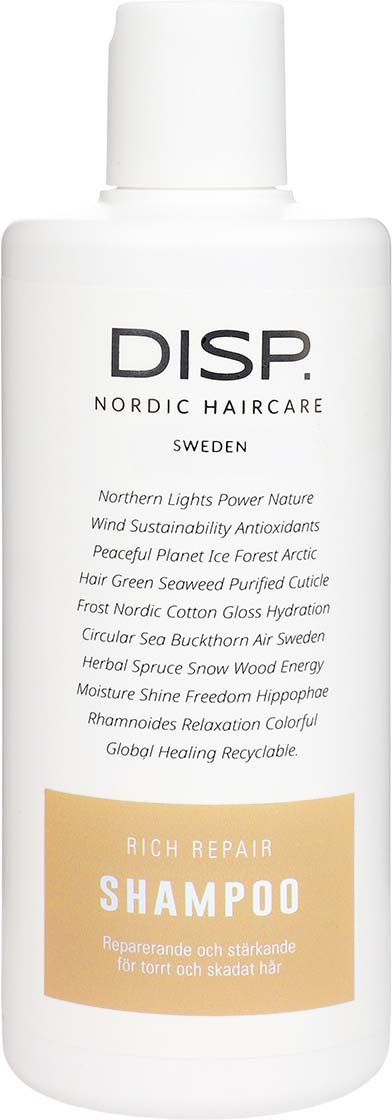 En hvit sjamposflaske med svart og oransje tekst, inneholder naturlige og bærekraftige hårpleieingredienser.