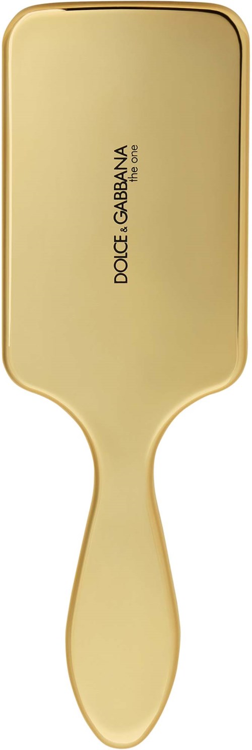 En gylden hårbørste med mærket Dolce & Gabbana.