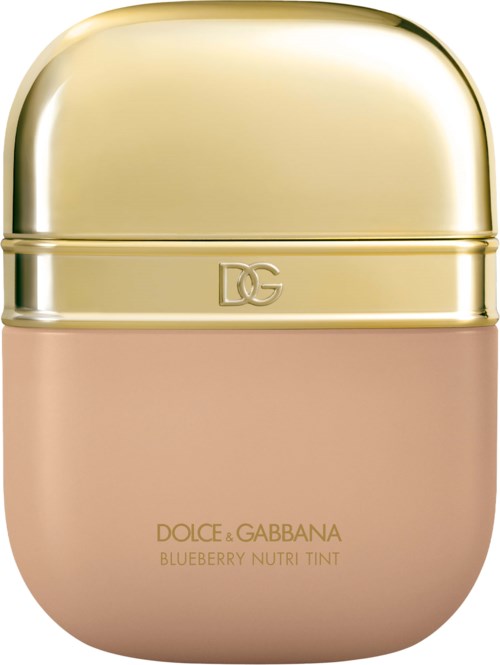 A small, beige container with a shiny gold cap and 'DG' initials, labeled as Dolce & Gabbana Blueberry Nutri Tint.