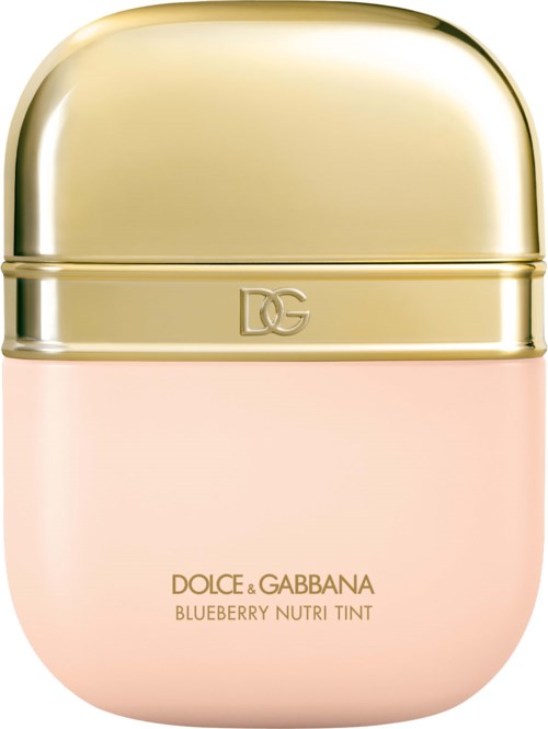 A small, round cosmetic container with a gold lid and pink bottom. It is a Dolce & Gabbana blueberry nutri tint.