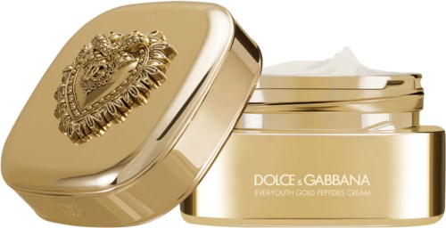Kremy złote Peptydy Dolce & Gabbana w błyszczącym złotym słoiku z ozdobnym wieczkiem.