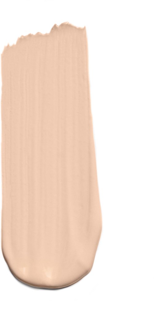 En prøve på beige sminke eller foundation med kremaktig tekstur på hvit bakgrunn.